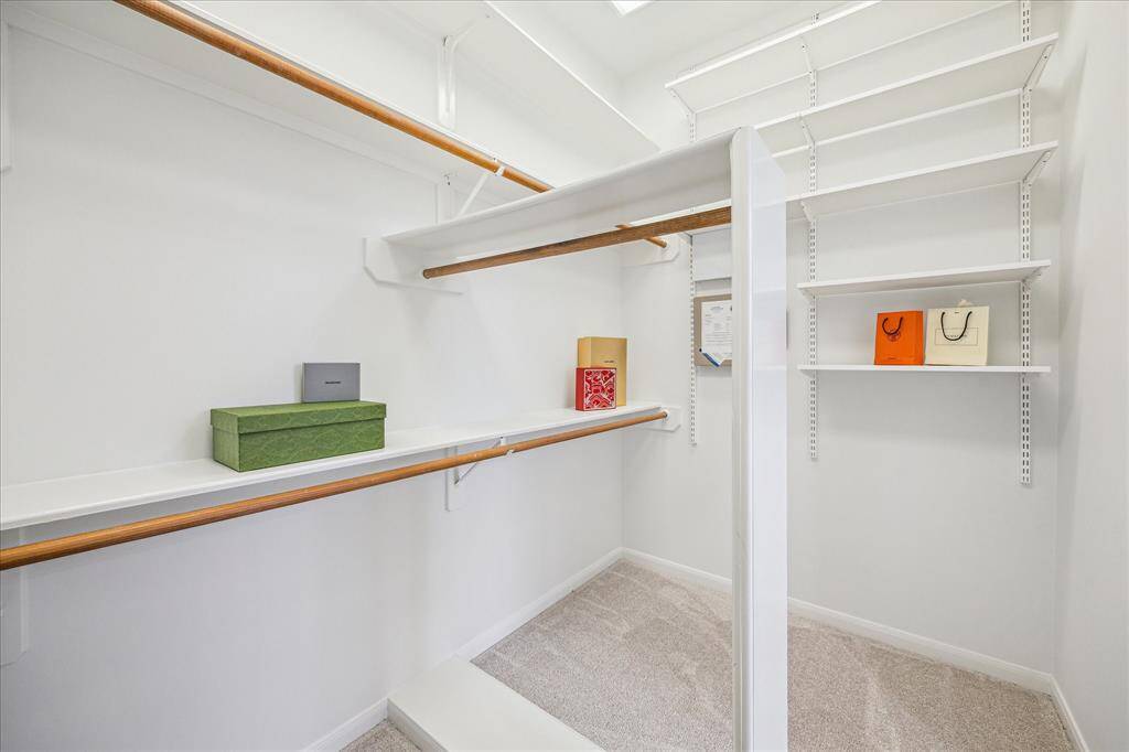 Look at the size of this primary closet!  Plenty of room for the fashionista in the household.