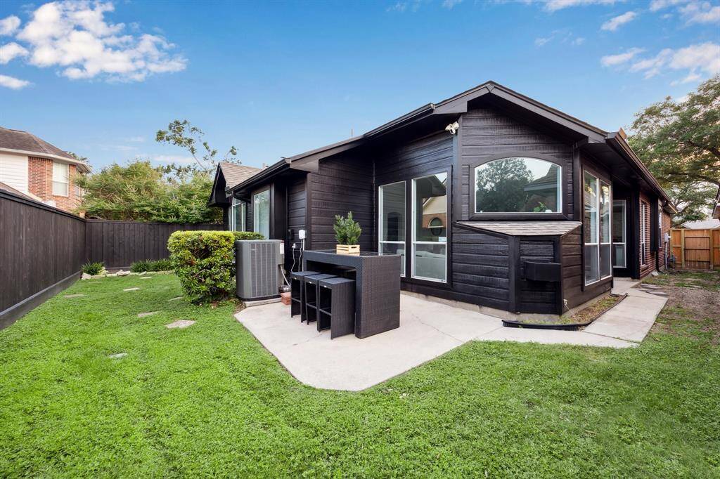 The back yard offers plenty of space for pets, play, gardening and entertaining.