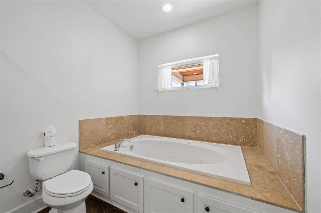 This bathroom is spectacular! It is complete with a large garden style jetted tub.