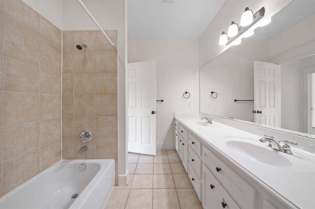 It is complete with a shower/tub combo, and a tile wall.