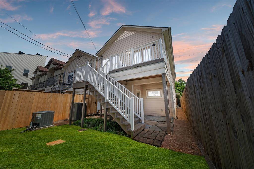 Welcome to your backyard, featuring easy access to the balcony and a covered patio—ideal for outdoor living and entertaining.