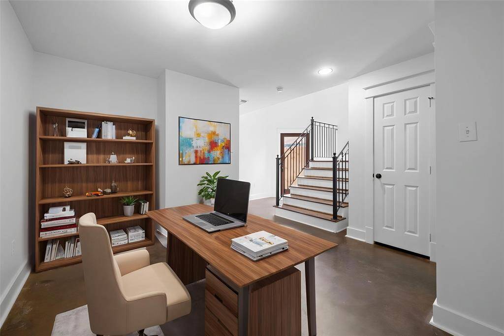 Virtually Staged: Quietly tucked away in the front of the home is the grand home office. This is the perfect space to read your favorite book or get some work done!