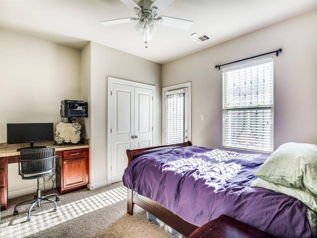 The guest bedroom on the first floor has carpet floors.