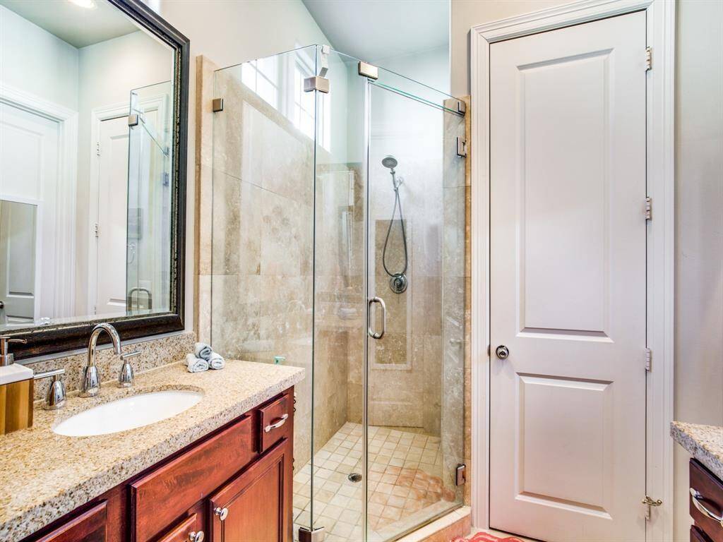 The double sink vanity provides tons of storage - both cabinets and drawers.