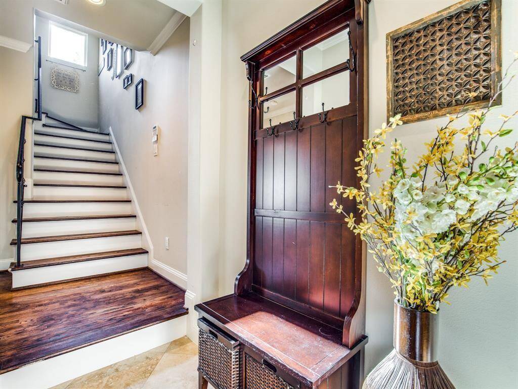 The first floor entry is tiled and has space for a small table or "mud room" shelving.