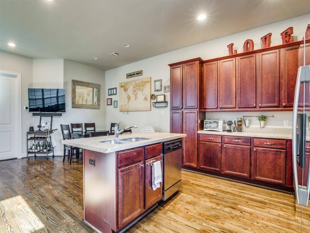 Island kitchen with tons of counter and cabinet space, plus a breakfast bar with granite counters, and stainless steel appliances.