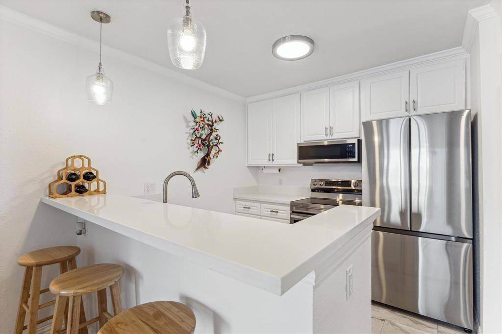 Dining table and eating bar gives you room to entertain.
