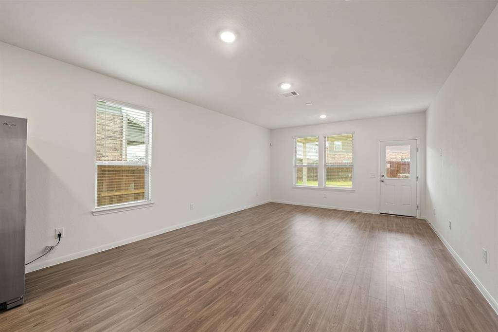The open-concept living area offers a spacious and inviting atmosphere.