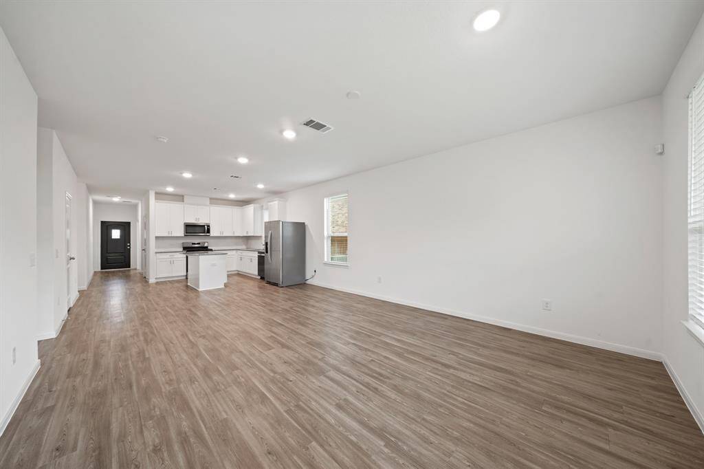 The open feel of the home encourages interaction and engagement, making it a welcoming and inviting place for family and friends to gather and enjoy each other's company.
