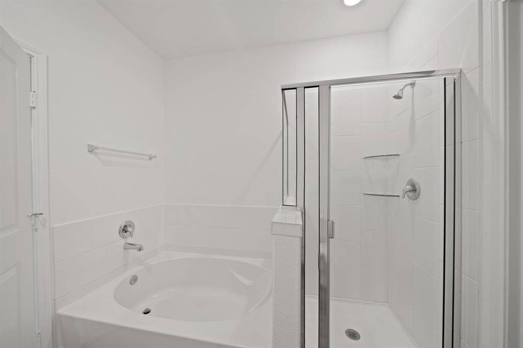 Relax in your beautiful soaking tub or opt for a quick rinse in the separate shower.