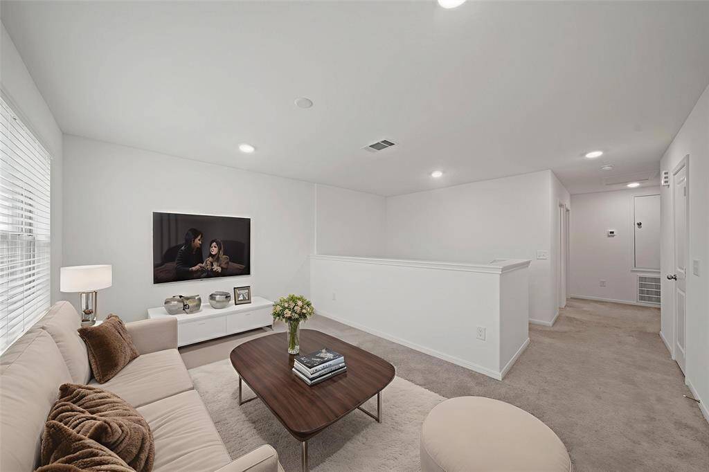 The game room is the perfect spot for fun. Let the kids rule the roost and keep the toys upstairs! - virtually staged