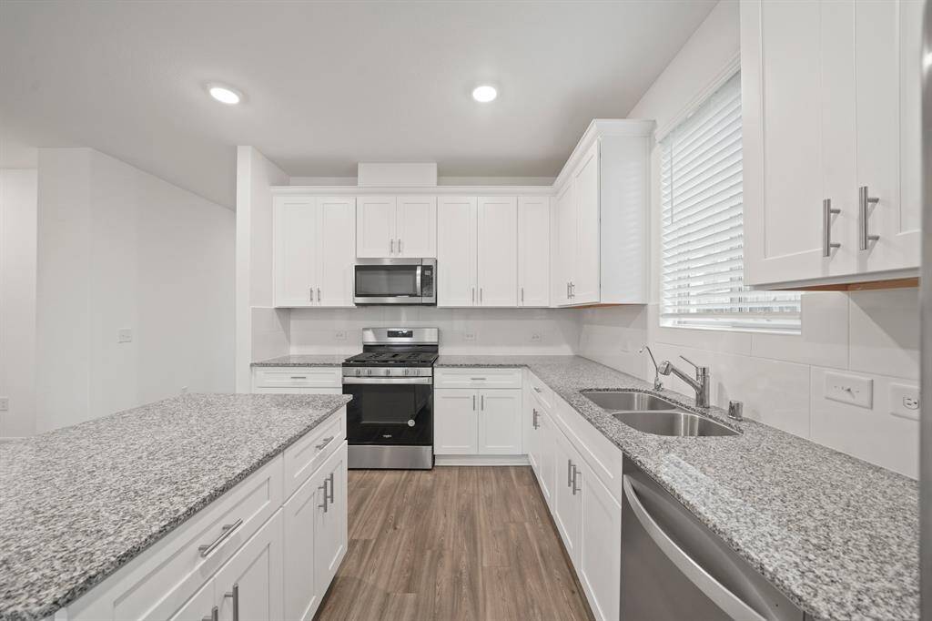 This kitchen offers lots of counter space and tons of cabinet storage. Perfect for every culinary adventure!