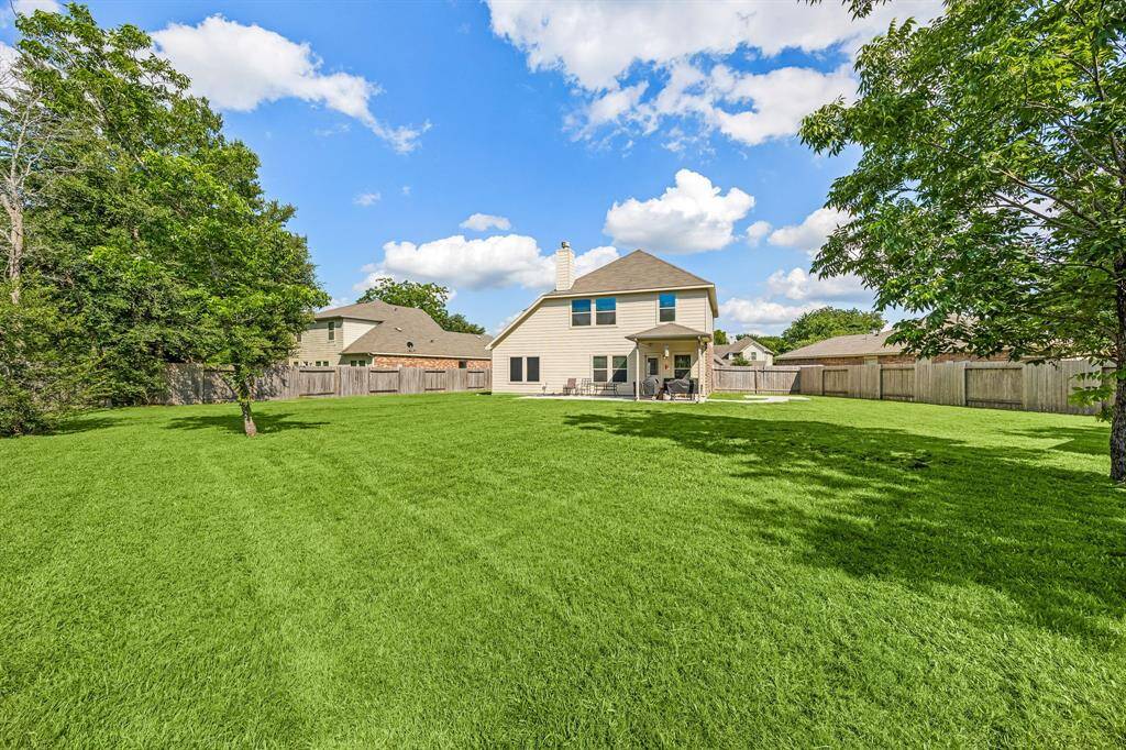 This backyard is enjoyable for everyone! From pets playing, kids jumping on the trampoline, or even having a garden, this amazing backyard provides space for endless activities for the whole family!