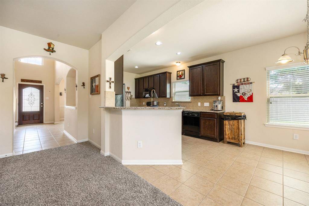 Breakfast bar area open to the family room and breakfast dining area