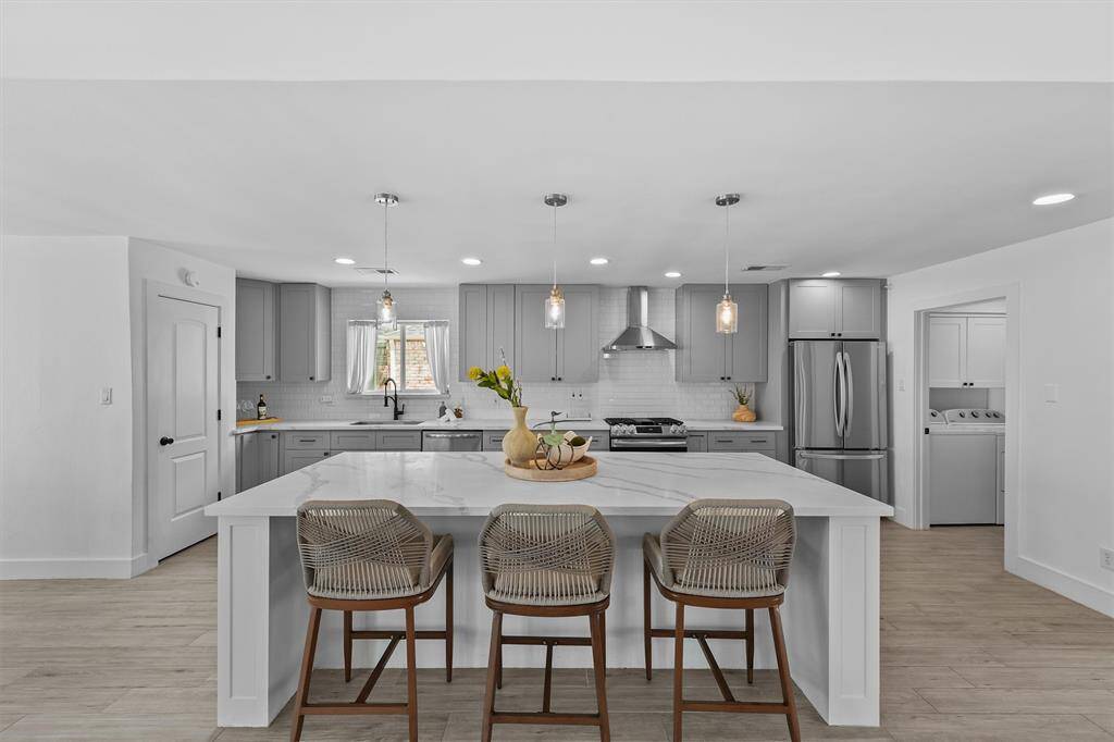 The kitchen is a show stopper.  Imagine hosting family and friends in this space.  Large walk-in pantry is to the left.