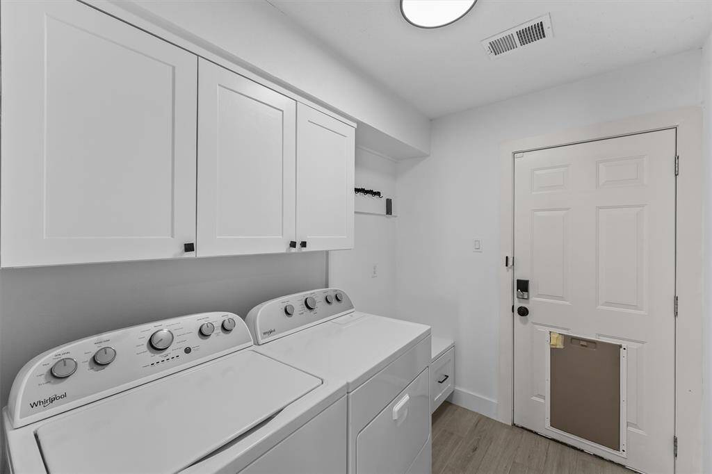 Utility room as you enter.  Perfect spot for shoe/bag storage as you enter from the garage!