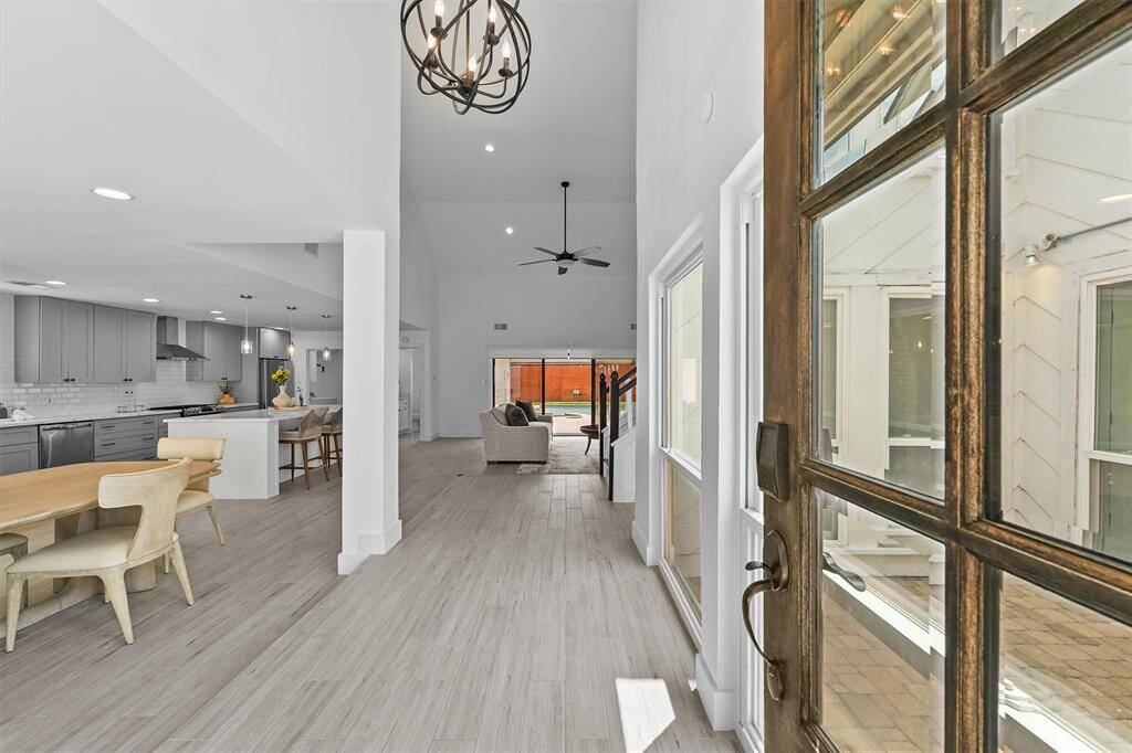Welcome home!  As you enter you will be greeted by a large dining area which can easily accomodate an 8 person table as well as soaring 16' ceilings.
