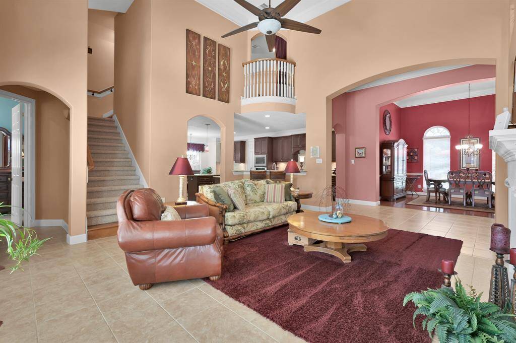 Two Story Living Room is Open to Dining Room and Kitchen.