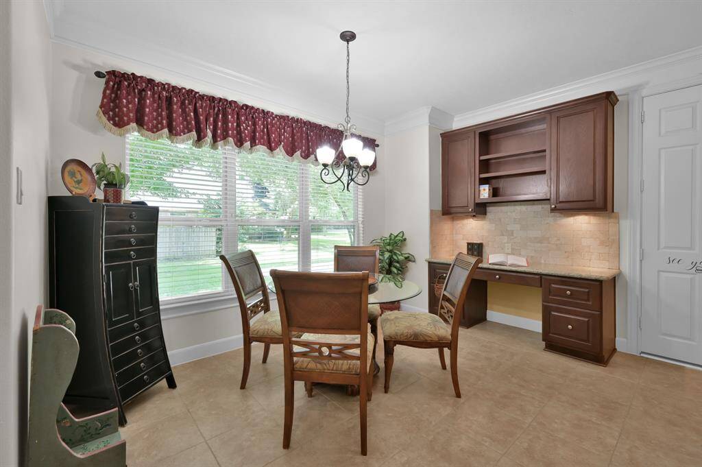 Spacious Breakfast Room and Desk Area Adjacent to Kitchen.