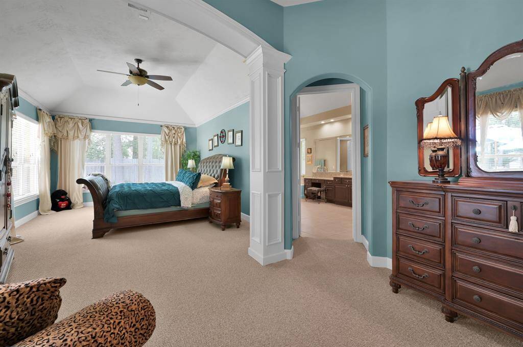 Lovely Sitting Area Flows to Primary Bedroom and Spa Bath, Accentuated by Beautiful Millwork.
