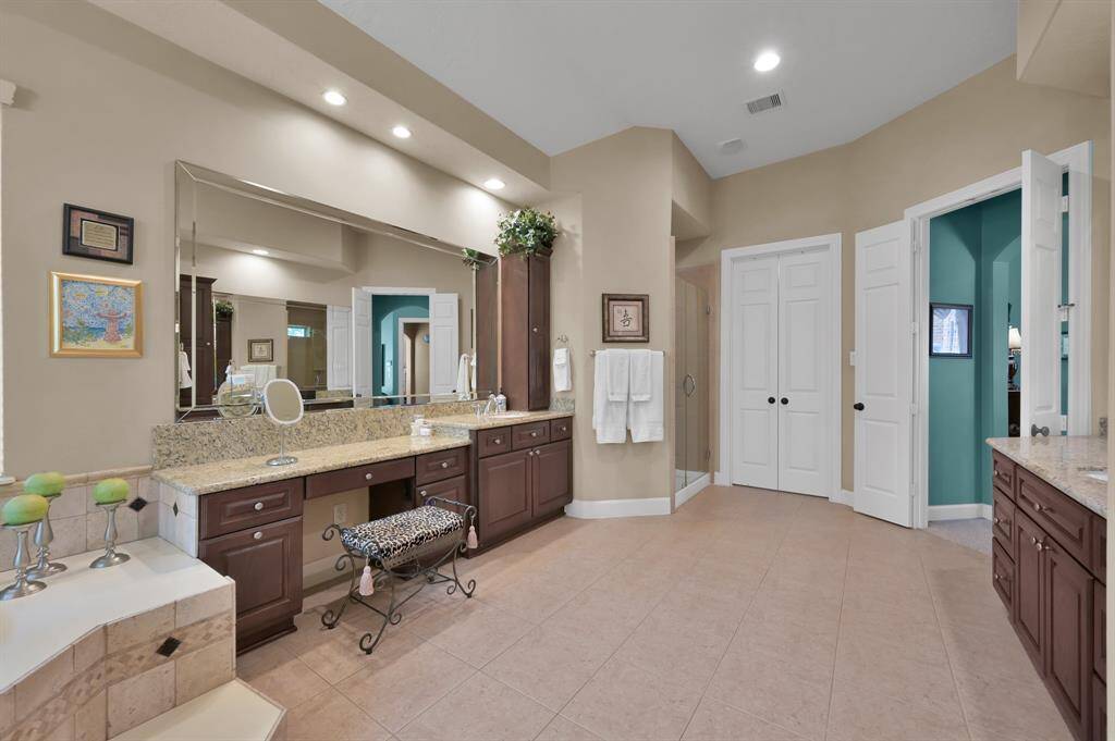 Storage Galore in Spa-Like Primary Bath That Connects to Walk In Closet and Utility Room.