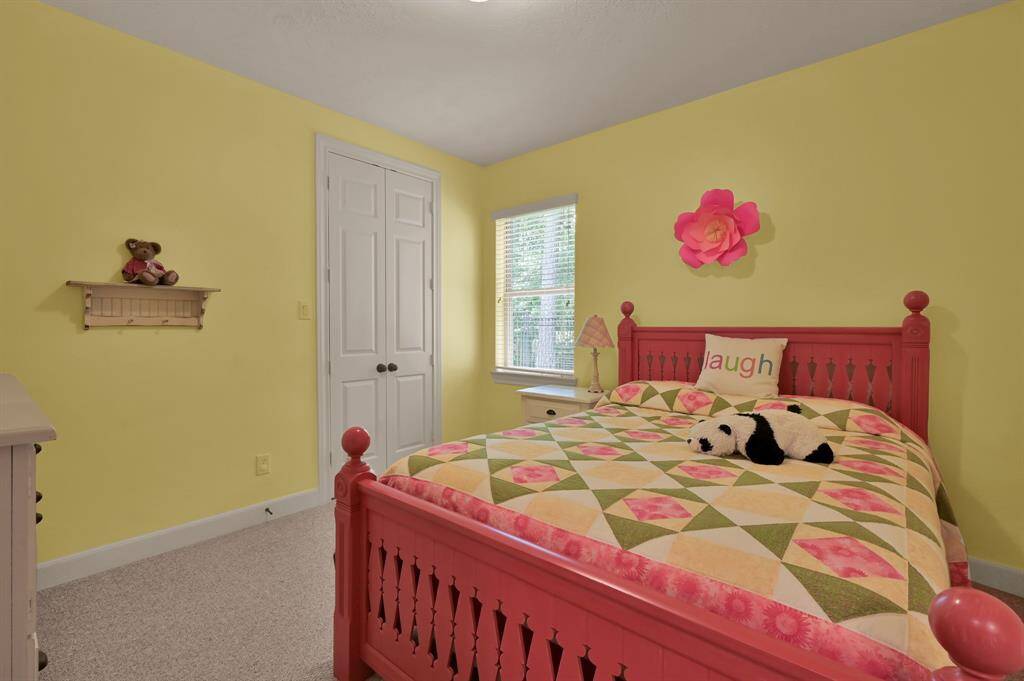 Sweet Secondary Bedroom is Warm and Inviting With a Walk In Closet.