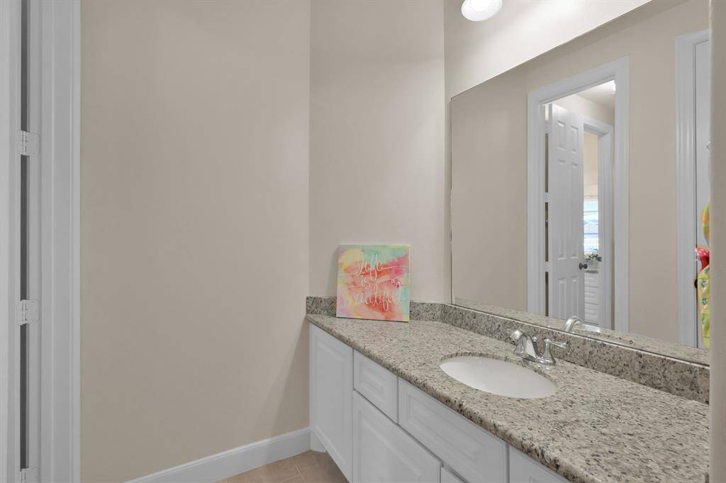Vanity Area in Jack and Jill Bathroom Offers Plenty of Counter Space and Storage.
