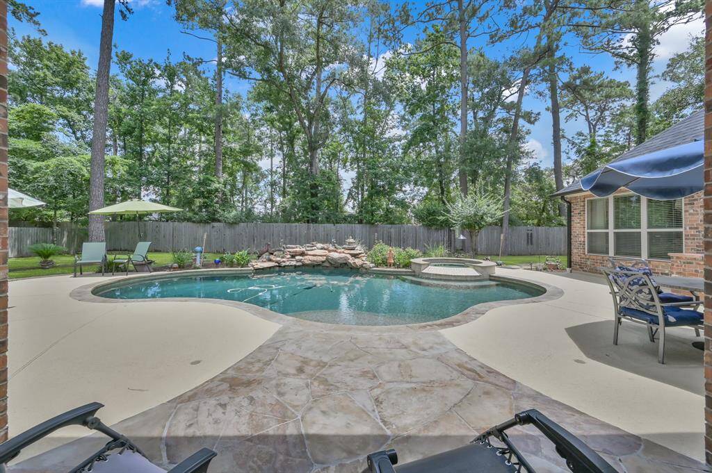 Curved Drive and Walkways Lead to Charming Courtyard.