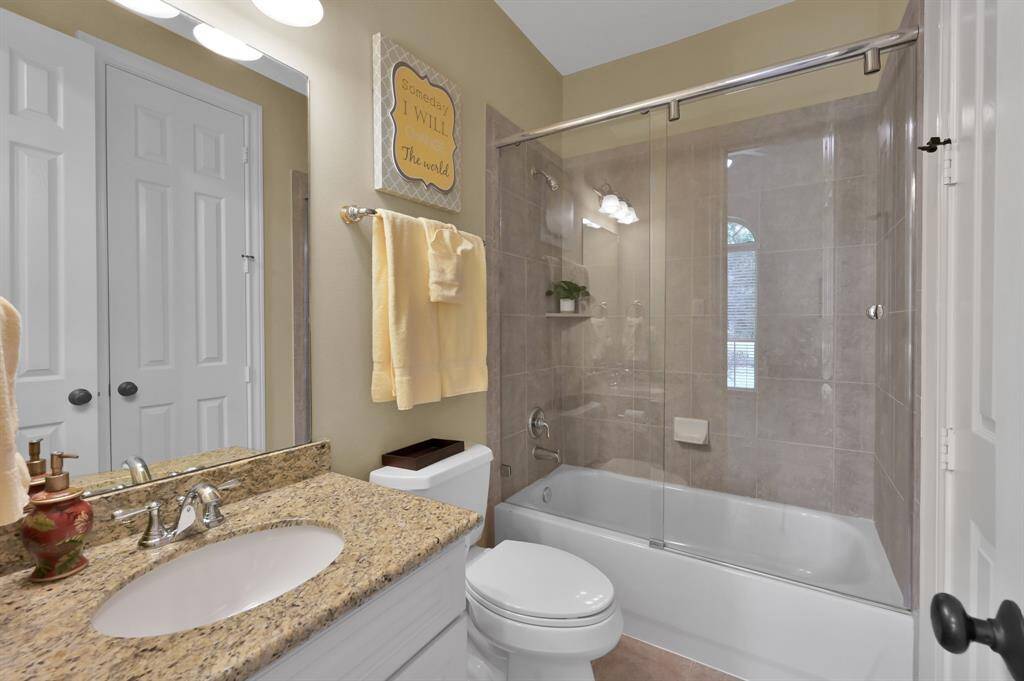 Secondary Bath Opens to Bedroom and Hallway.