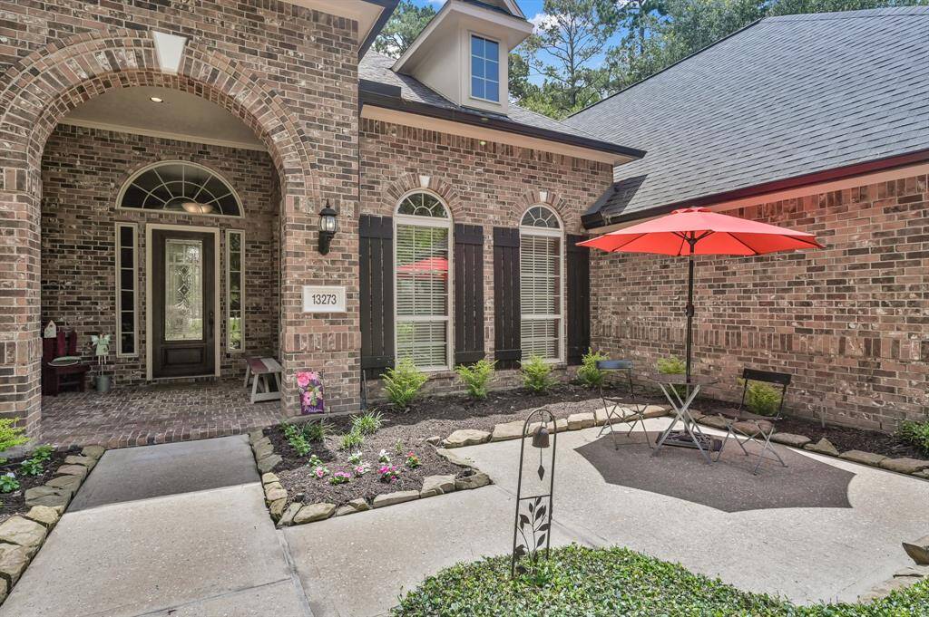 Delightful Courtyard is Surrounded by Lush Landscaping.