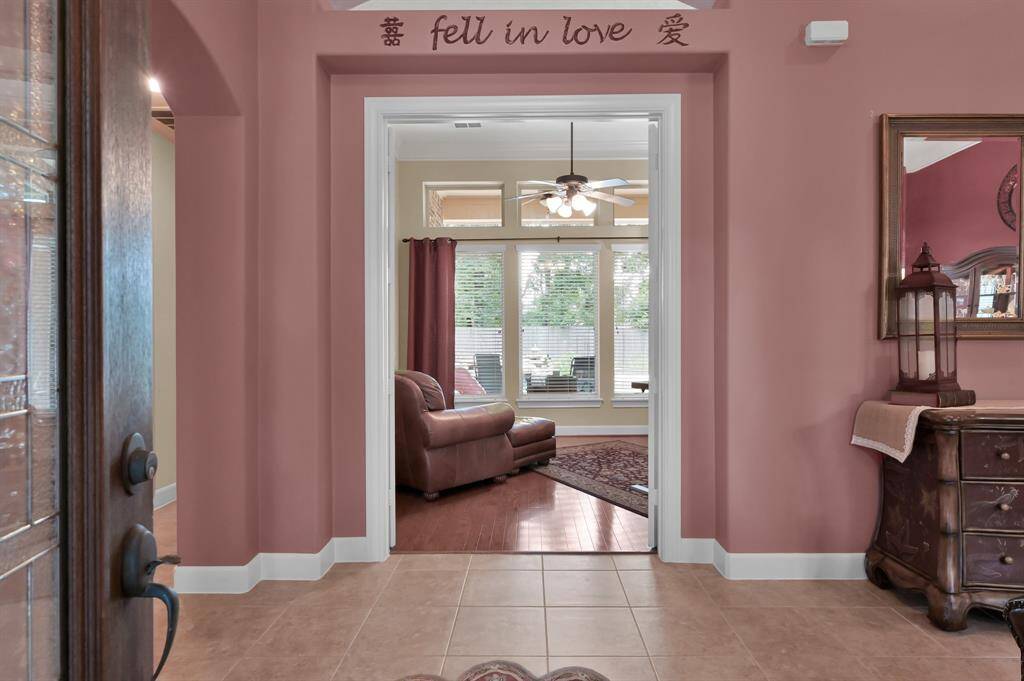 Elegant Foyer Opens to Study Through French Doors.