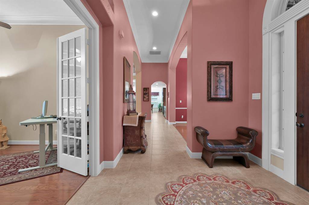 Foyer Leads to Formal Dining Room and Living Room.