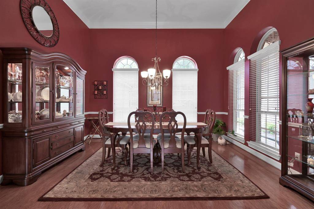 Expansive Dining Room Features Hardwood Floors.