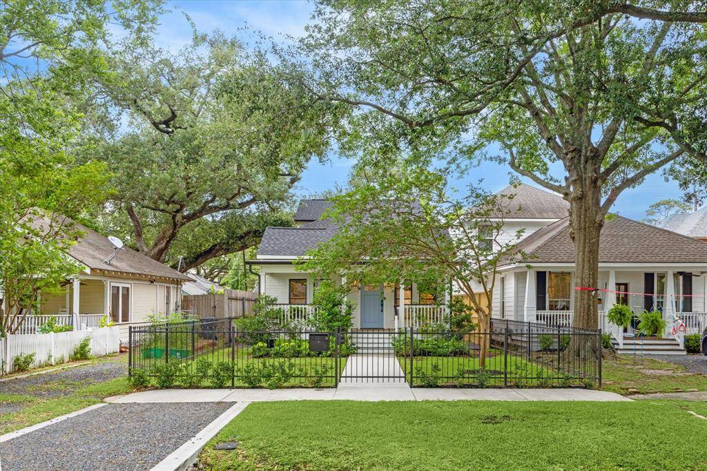 The front of the property features a dedicated parking space and gated front yard. There is an alleyway to access your garage entry.