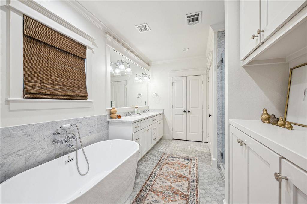 Ensuite with marble throughout and an amazing soaking tub