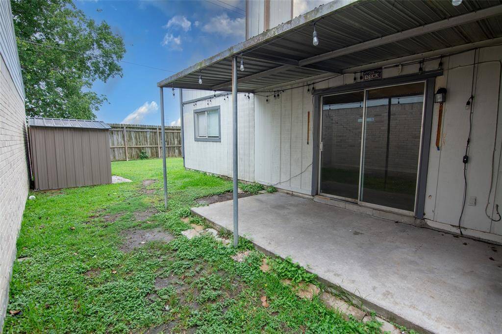 Patio Doors into this Private Side Yard with a Storage Shed