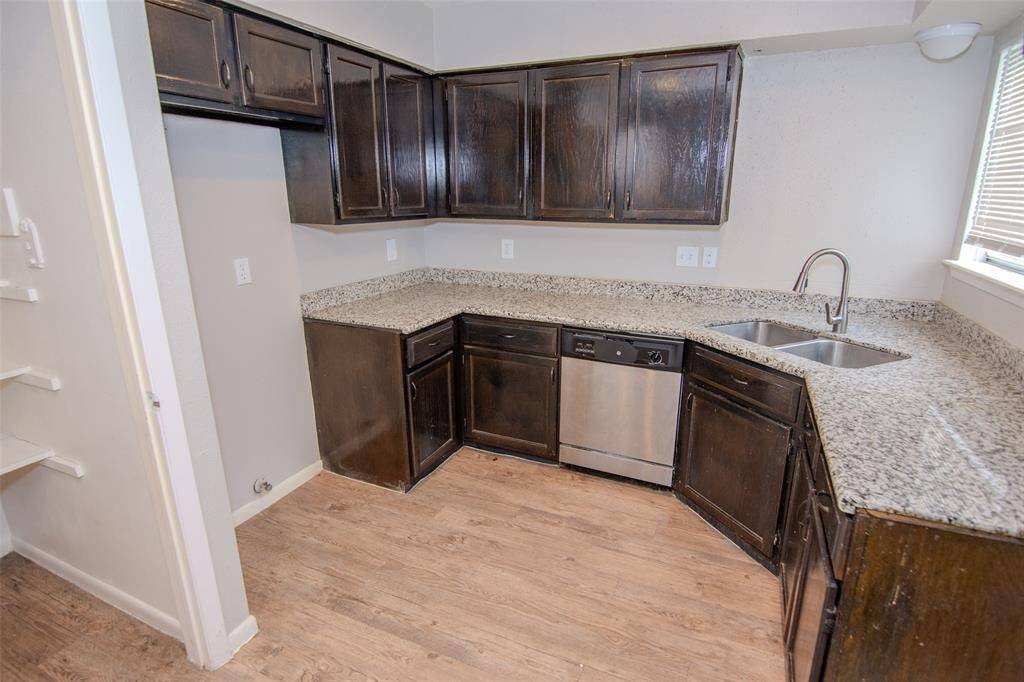 Kitchen with Granite Countertops, Breakfast Bar and Stainless Steel Appliances
