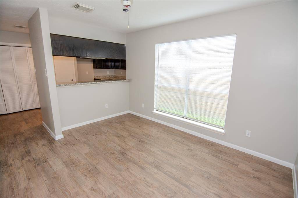 Dining Room up against Breakfast Bar with lots of Natural Light