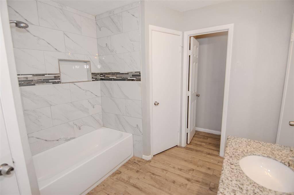 Two Walk-in Closets featured in this En Suite Primary Bathroom