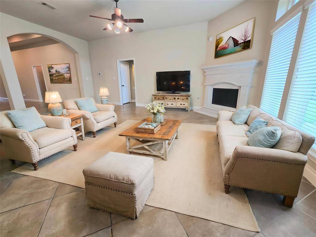 Living Room with Stone Fireplace. Virtually staged for furniture arrangement inspiration