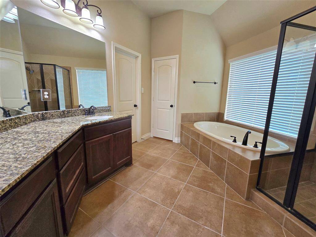 Primary Bath with Garden Tub and Separate Shower.