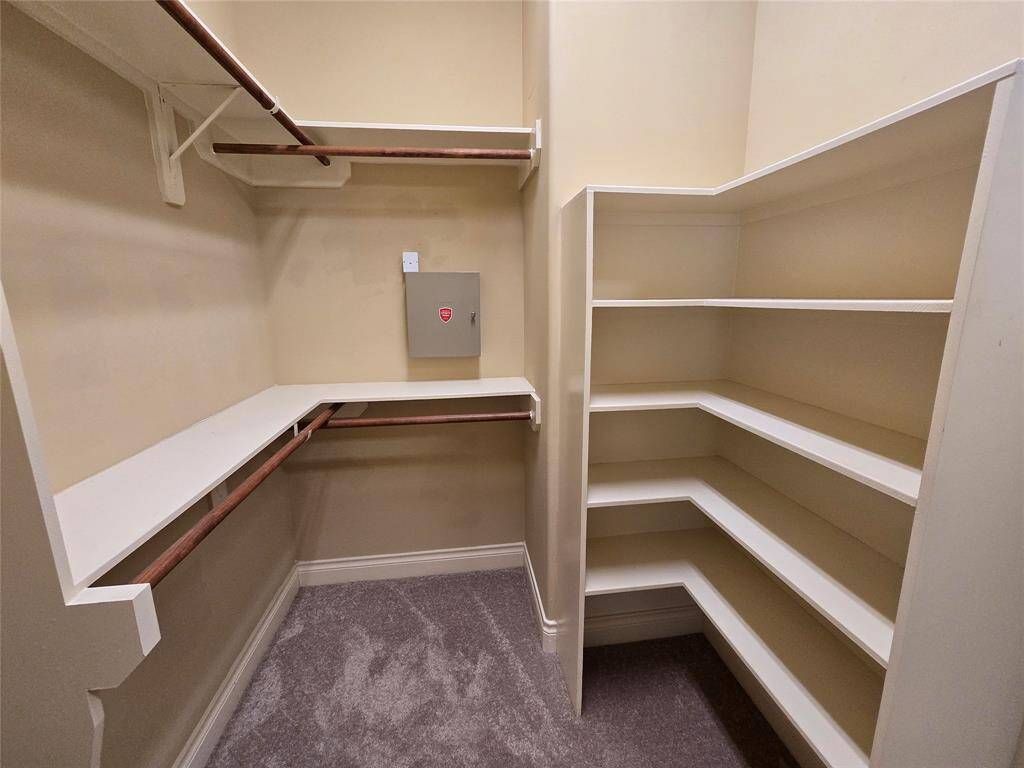 Primary Walk in Closet with 2 side of closet space