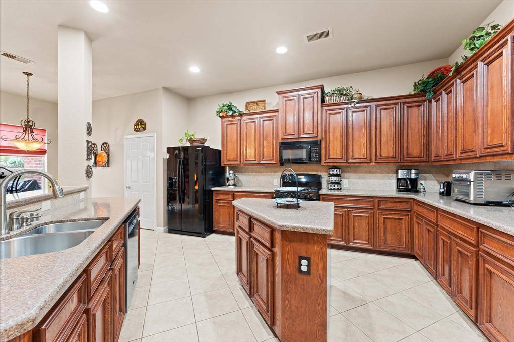 Ample storage in this oversized kitchen open to the living room