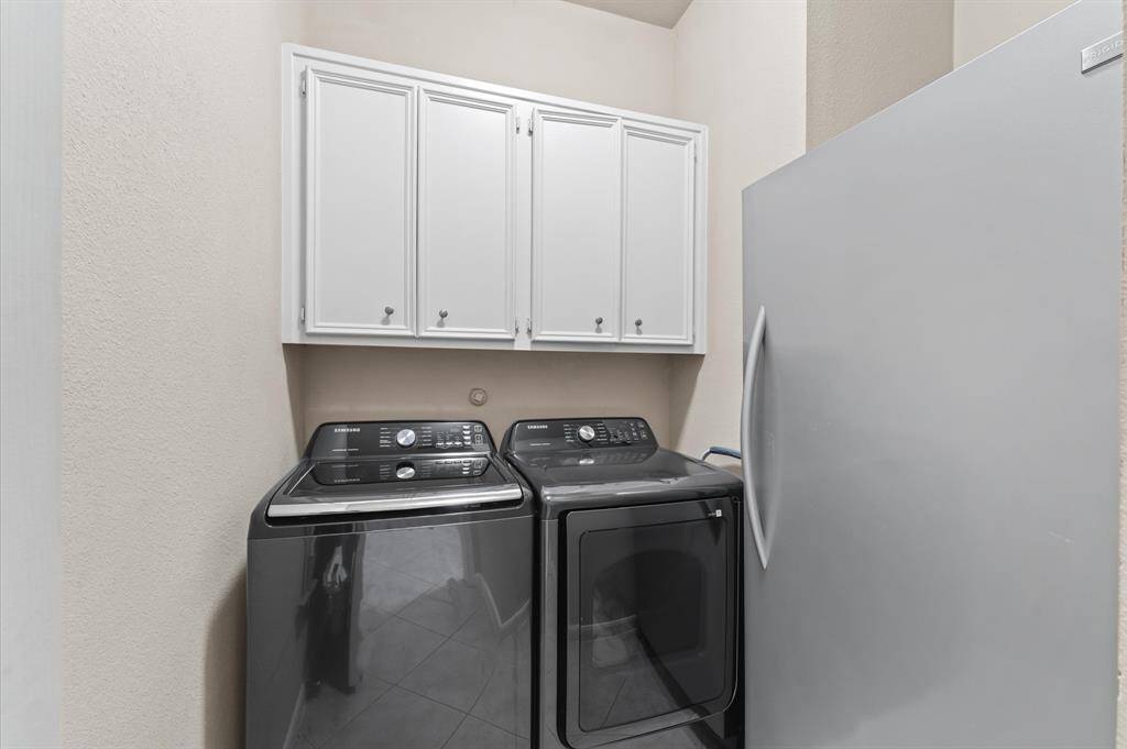 Utility room washer, dryer and a spare fridge fit in here.
