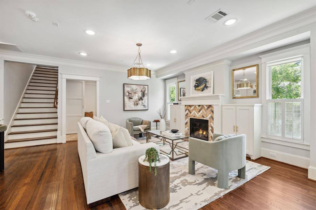 Stylish and bright with custom built-ins and a statement brick fireplace.
