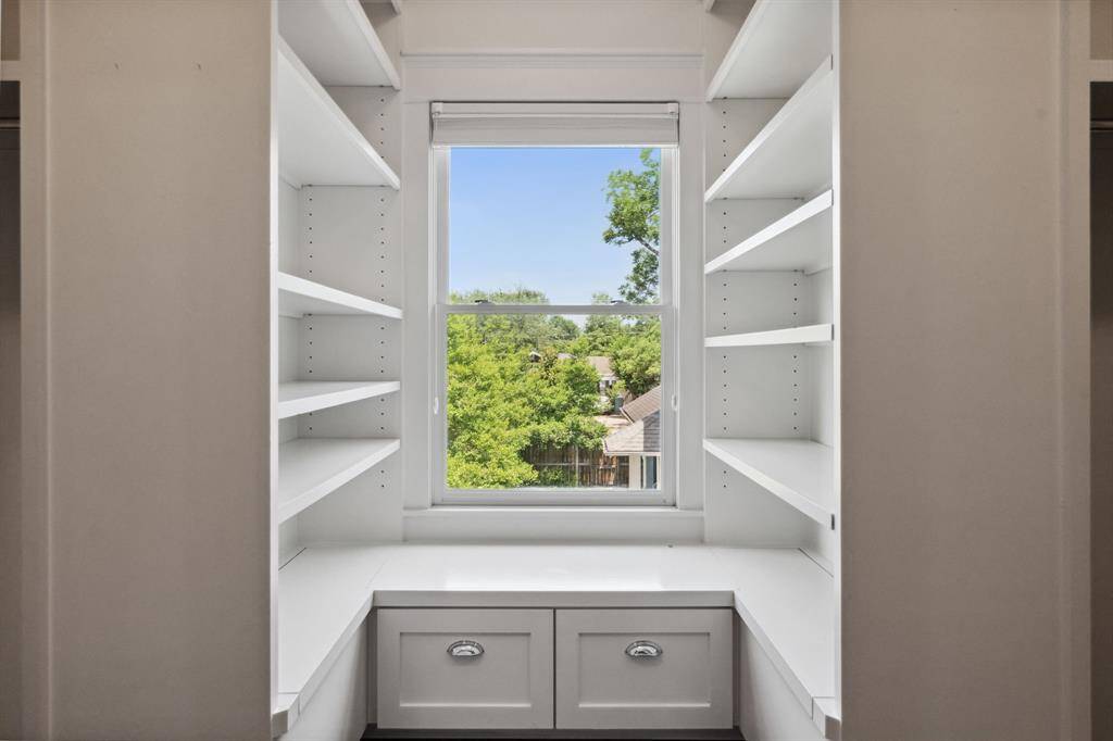 A windowed niche where bench opens offering extra storage space.