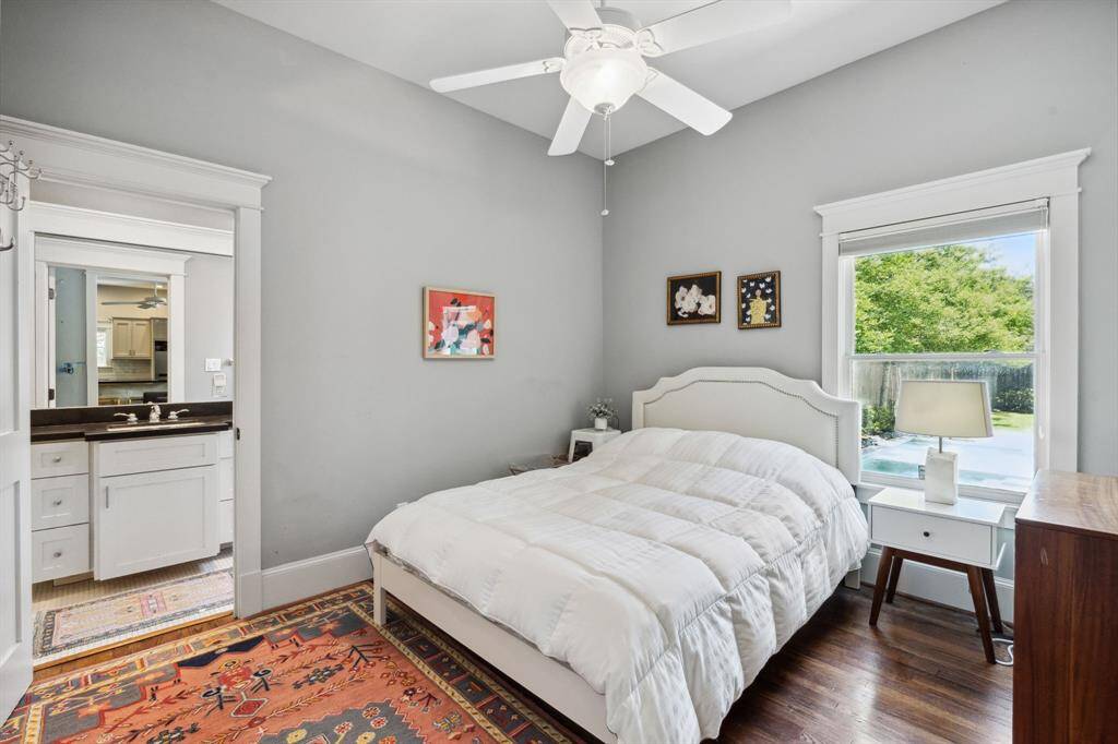 Bedroom with a large window and en suite bath.