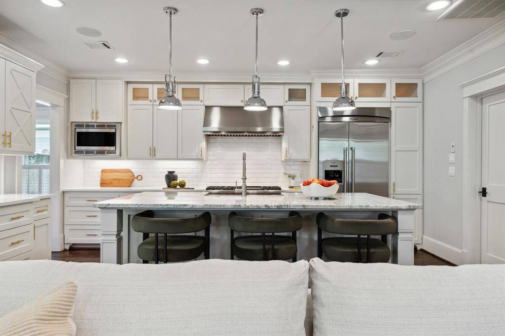 Open-concept flow from the living area into a kitchen that stuns with every detail.