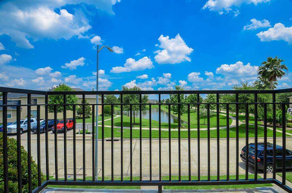 Relax on the balcony overlooking a serene view.