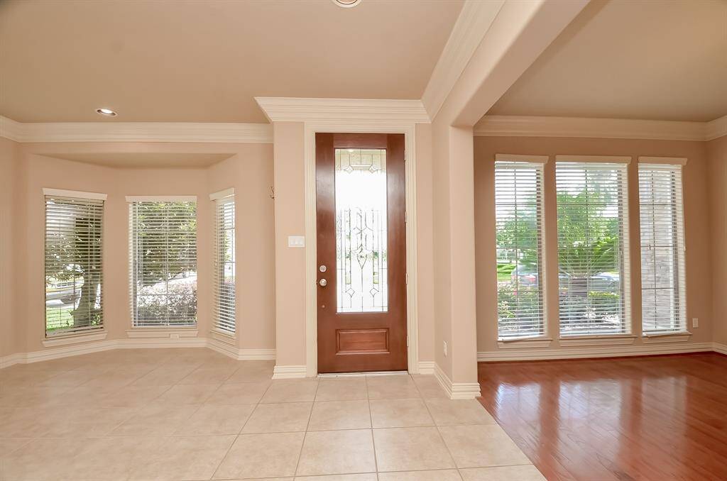 Elegant room with tile floors offering stunning lake views.